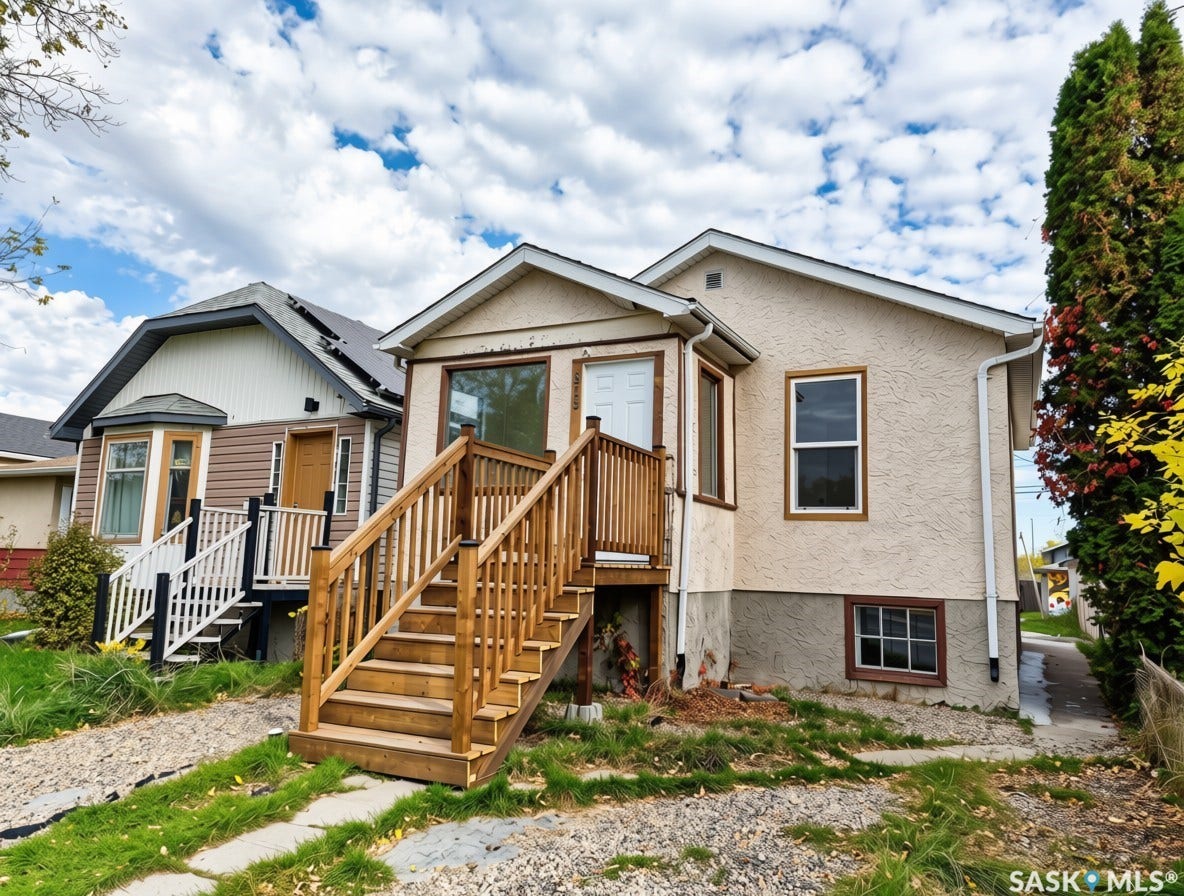 Exterior features stucco finish, new wood deck, and wood-framed windows