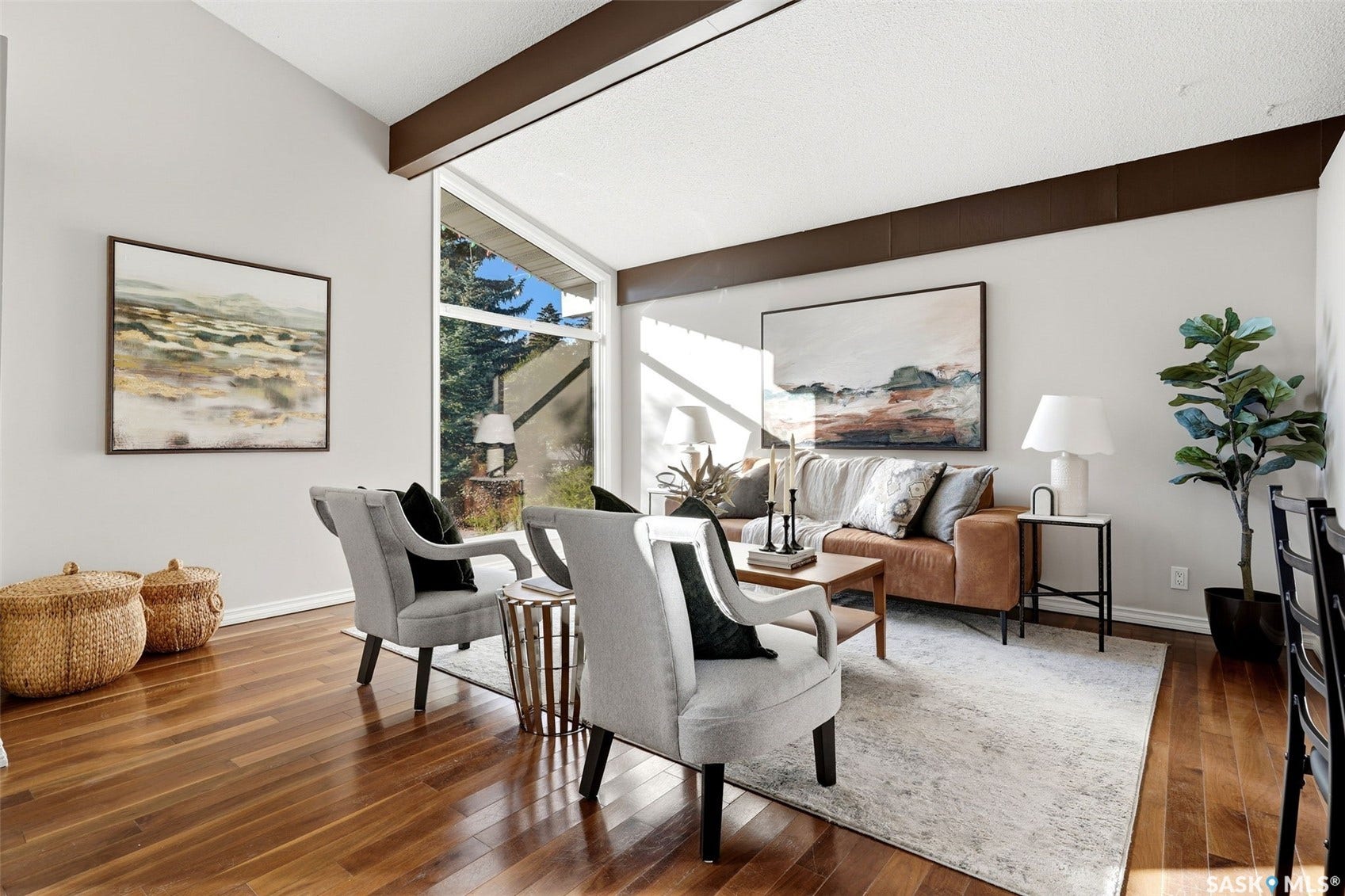3361 Wascana Street, Regina SK S4S 2H2 Vaulted ceiling with exposed beams, large picture windows, wood-finish flooring, and light wall finishes