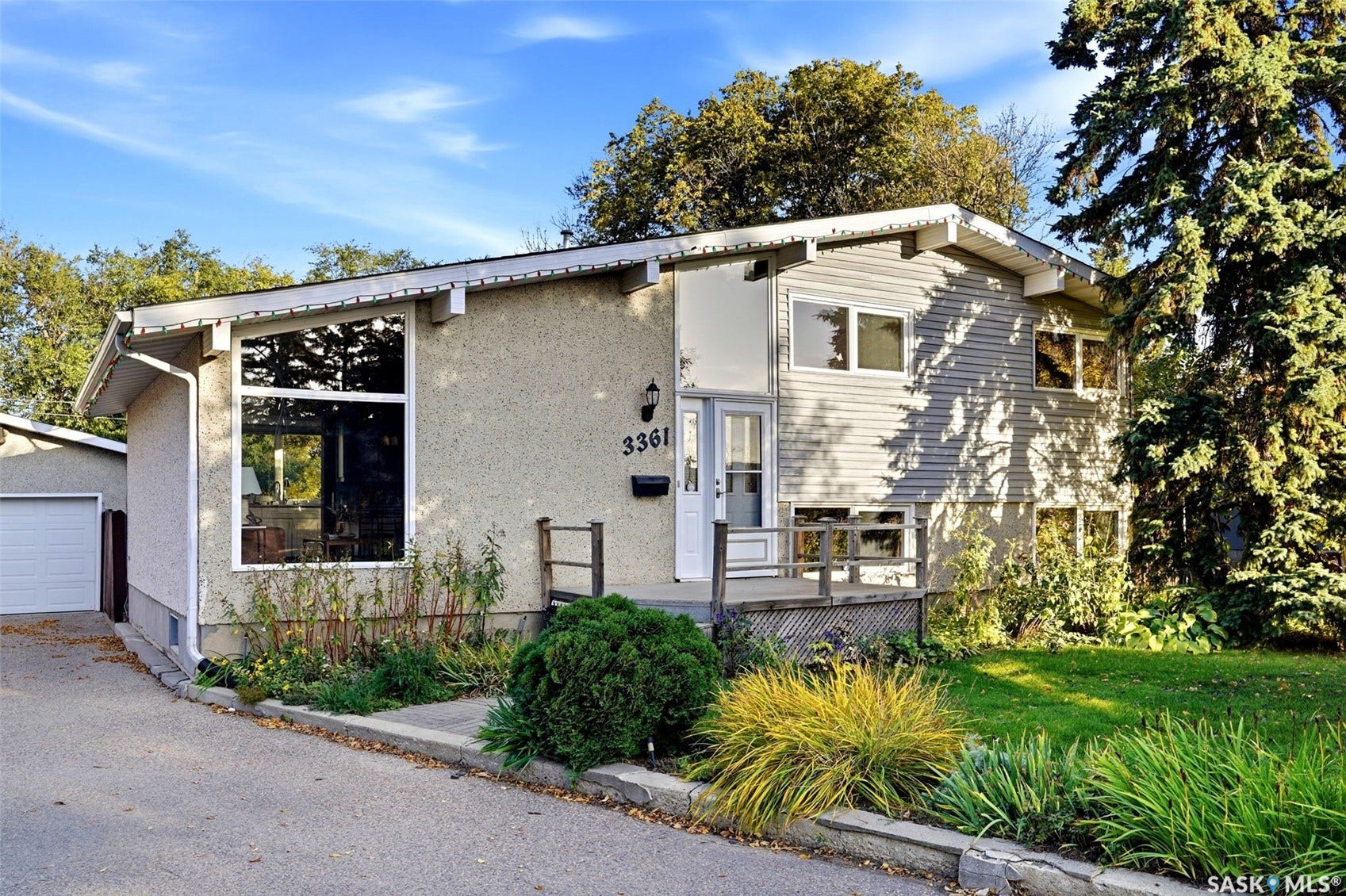 3361 Wascana Street, Regina SK S4S 2H2 Split-level residence featuring stucco and siding exterior finishes