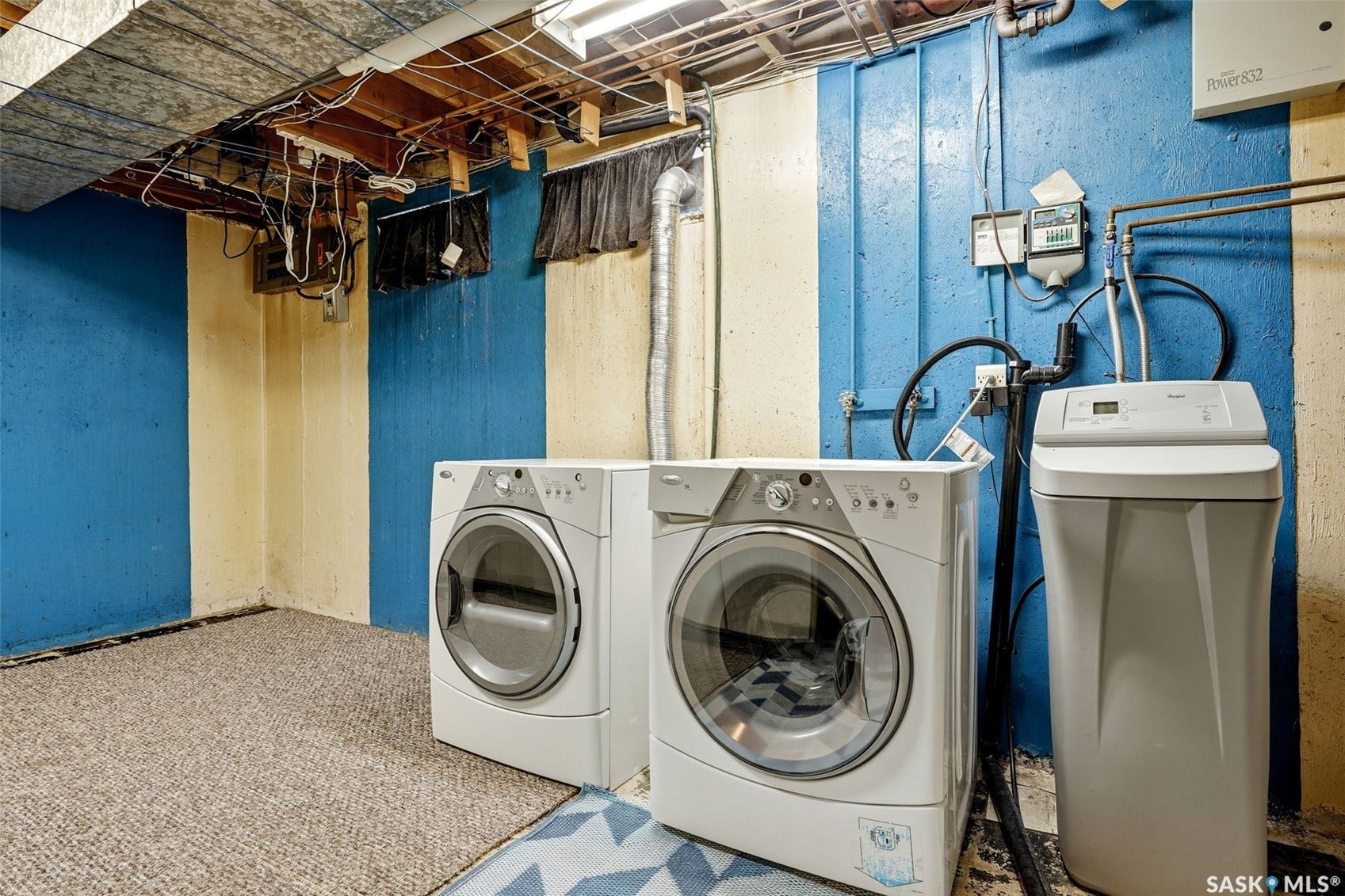 3361 Wascana Street, Regina SK S4S 2H2 Utility area featuring a washer, dryer, water softener system, and exposed ceiling joists