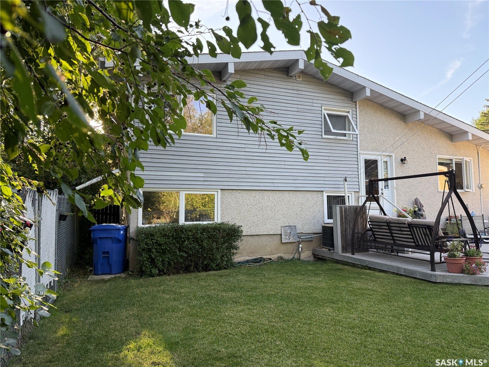 3361 Wascana Street, Regina SK S4S 2H2 Manicured lawn with a concrete patio