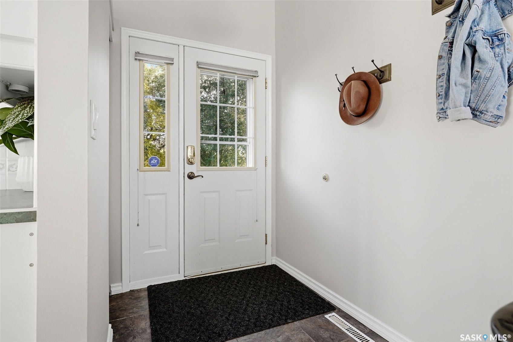 3361 Wascana Street, Regina SK S4S 2H2 Entry door with a full-length window and an adjacent sidelight window