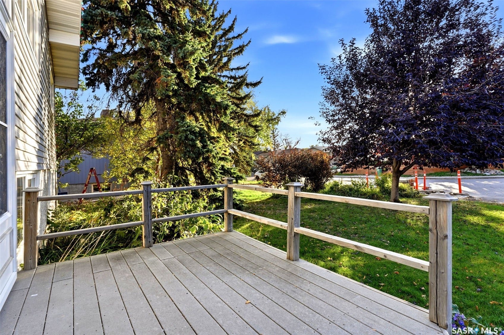3361 Wascana Street, Regina SK S4S 2H2 Expansive outdoor deck with wood-finish flooring and a natural wood railing