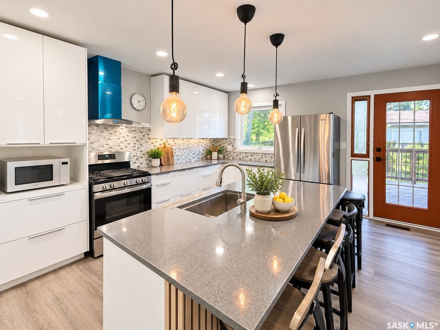 5810 Sherwood Drive, Regina SK S4T 6Y7 Kitchen featuring white cabinetry, a large kitchen island with counter seating, stainless steel appliances, a tiled backsplash, and recessed lighting