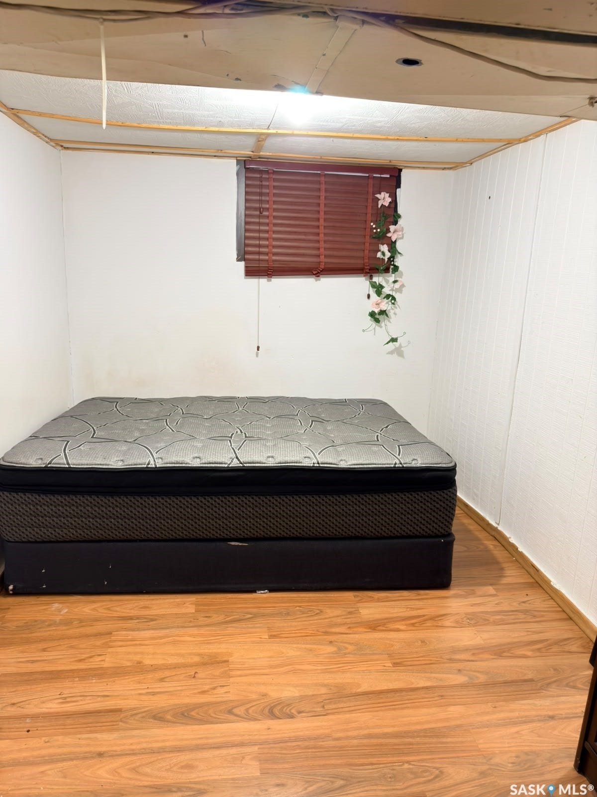 Wood-finish flooring with white wall finishes