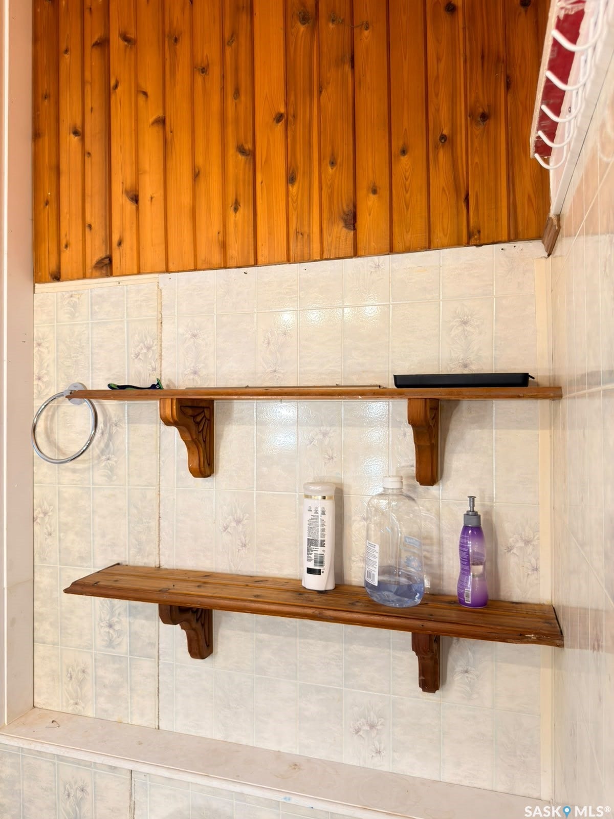 Wood paneling accent wall complemented by tiled wainscoting