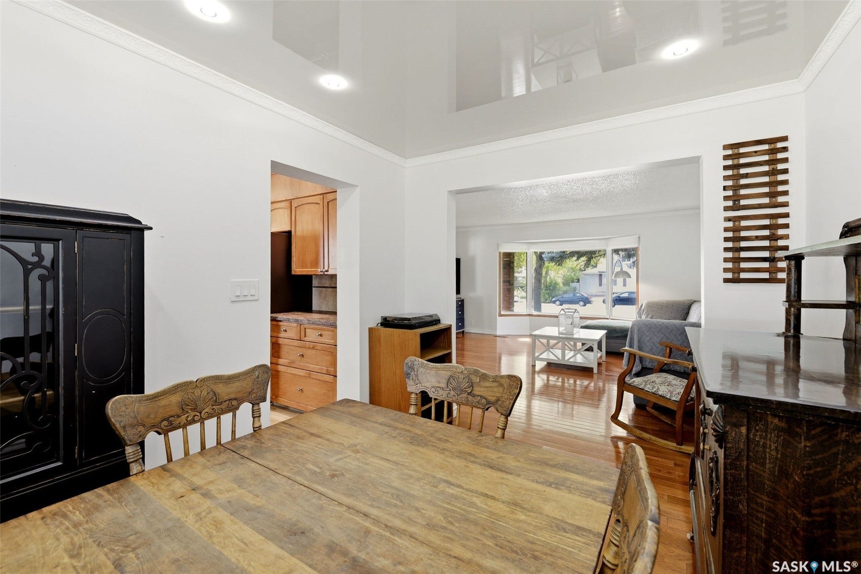 Wood-finish flooring throughout, recessed lighting, and crown molding