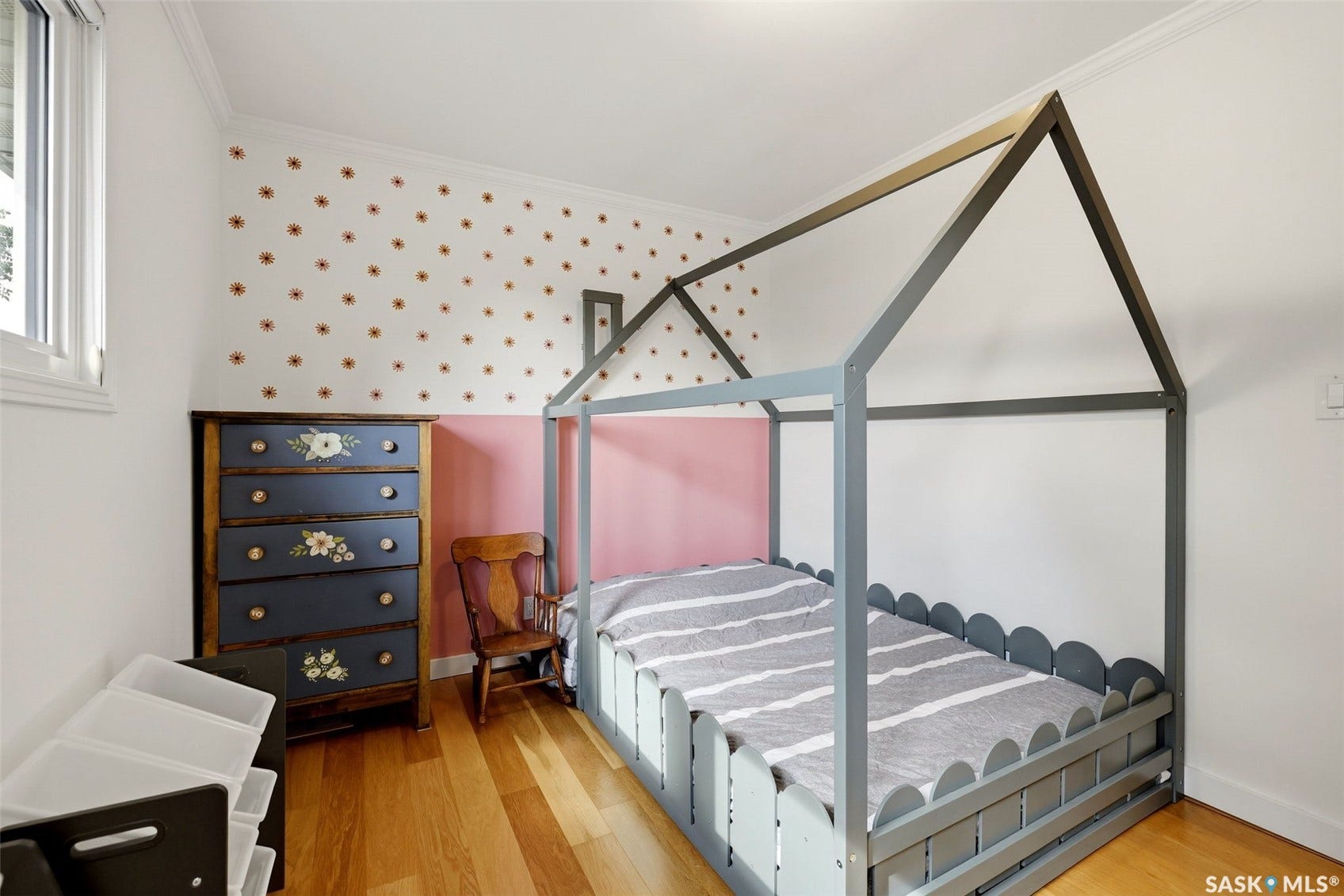 Hardwood flooring, painted walls, window with trim, crown molding