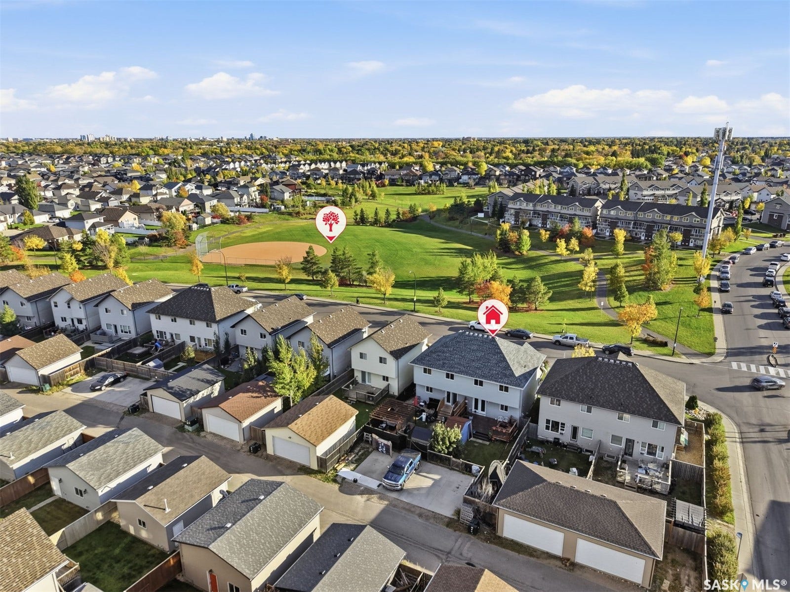 Aerial perspective showcasing residential properties with asphalt shingle roofs
