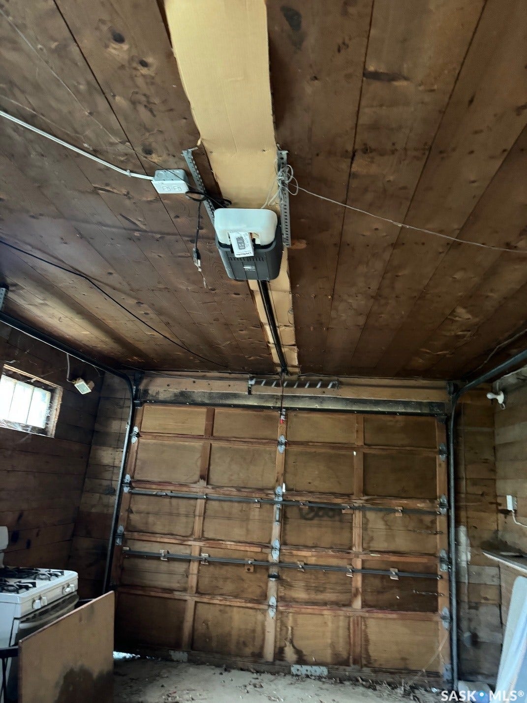 Wood-paneled ceiling with exposed beams