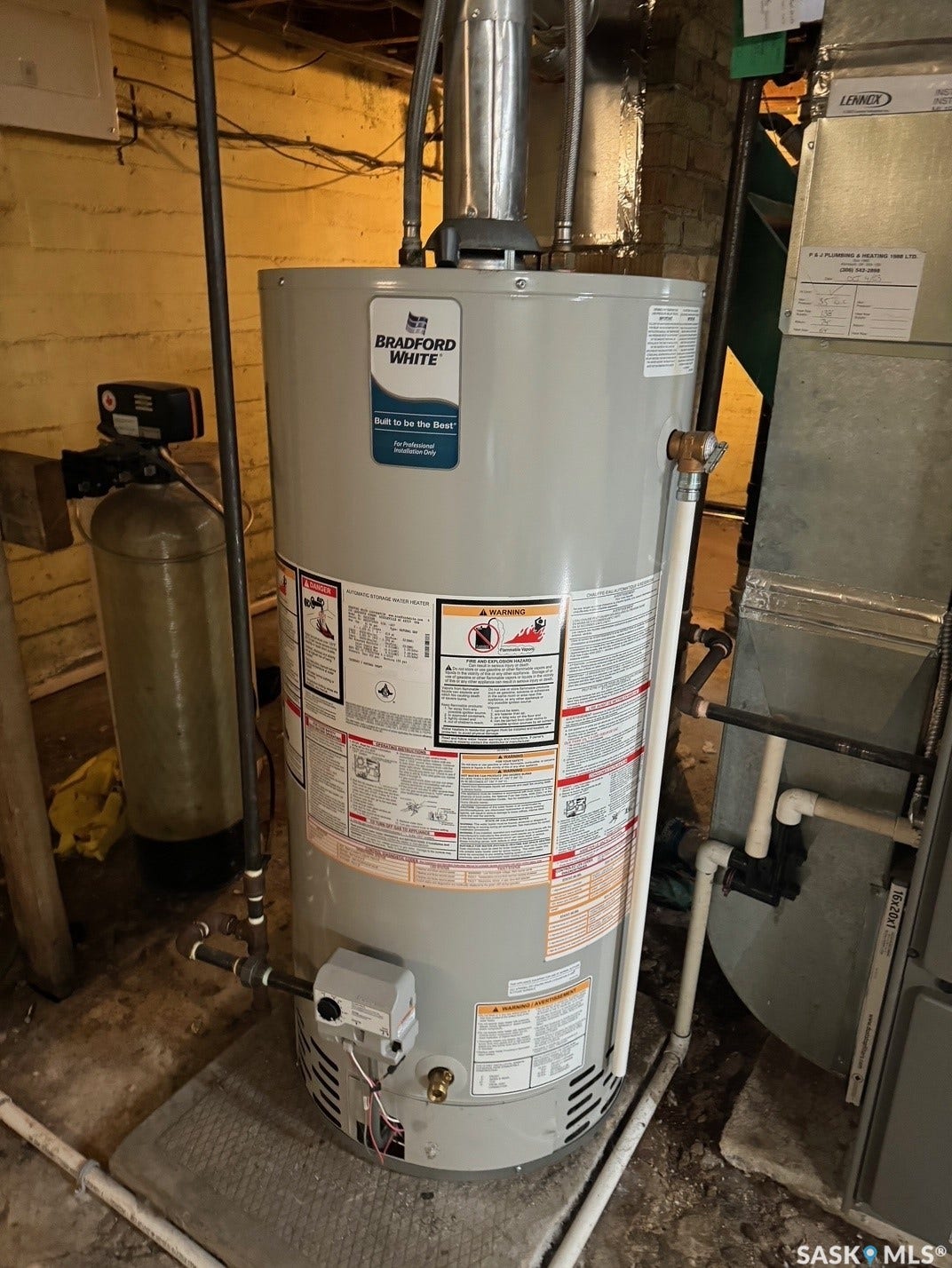 Bradford White water heater with associated ductwork and piping