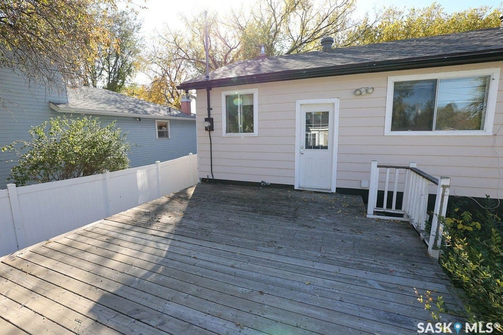 Expansive wood deck with white vinyl fencing