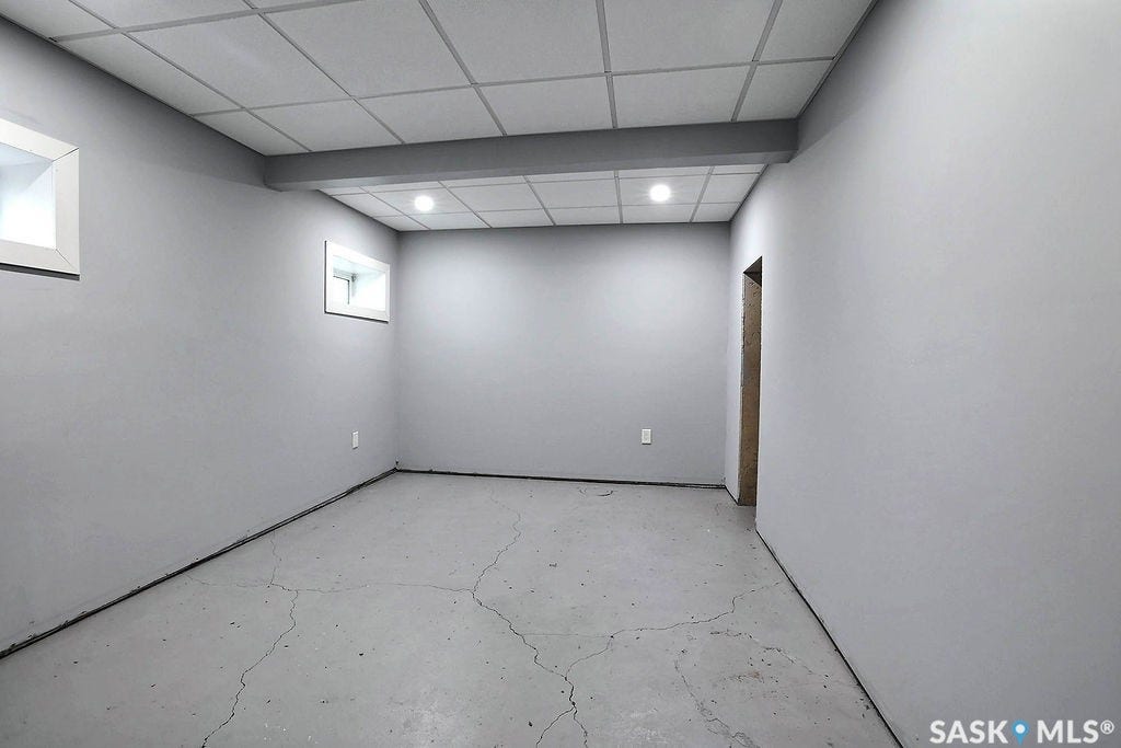 Recessed lighting, drop ceiling, and two windows