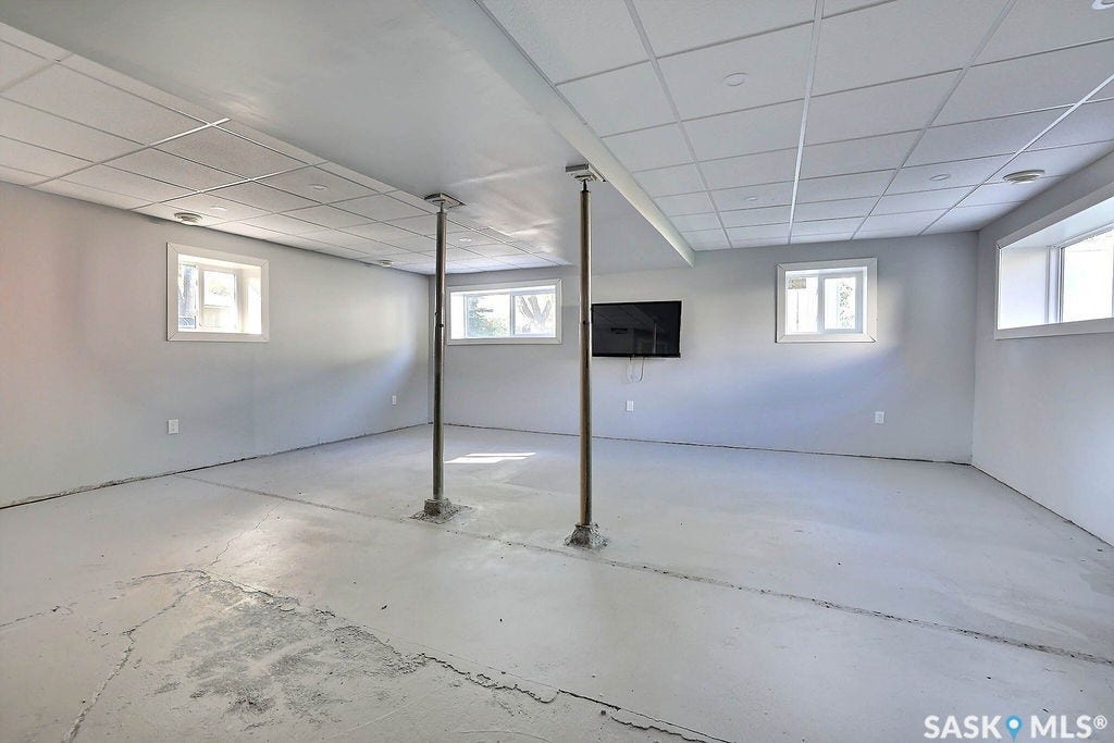 Finished wall surfaces, drop ceiling, and multiple windows