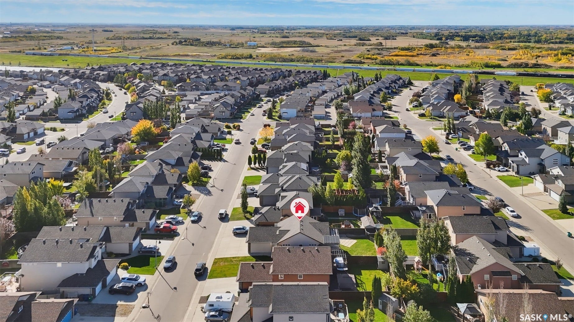 Residential area with extensive paved streets and surrounding natural landscape