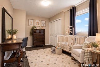 Built-in closet with bi-fold doors, overhead lighting, and a window with dark curtains-- AI generated
