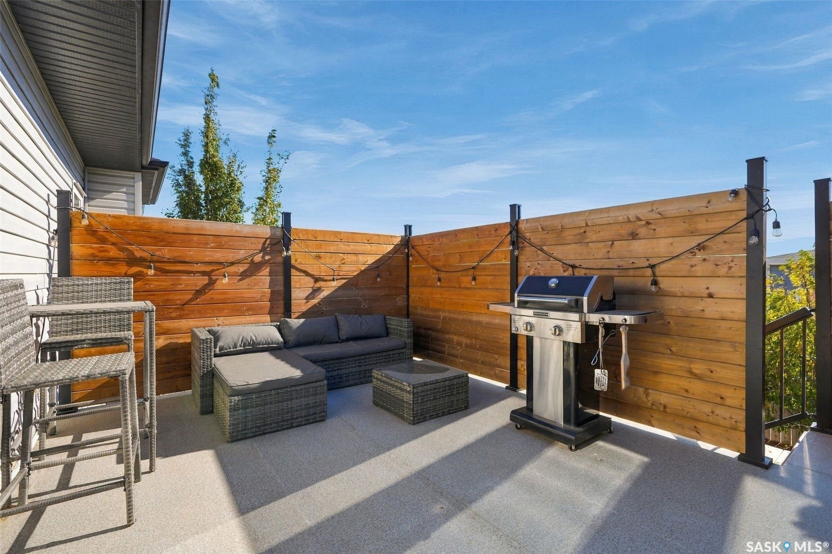 Outdoor patio with wood privacy fencing