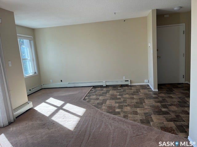 Two-tone wall color with a baseboard heating system