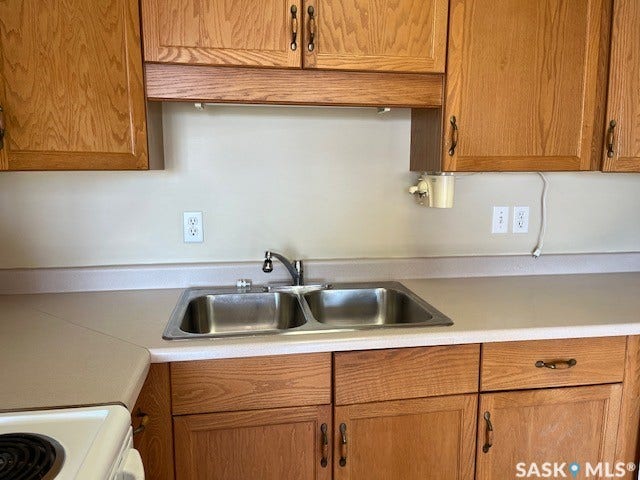 Wood cabinetry with dark hardware