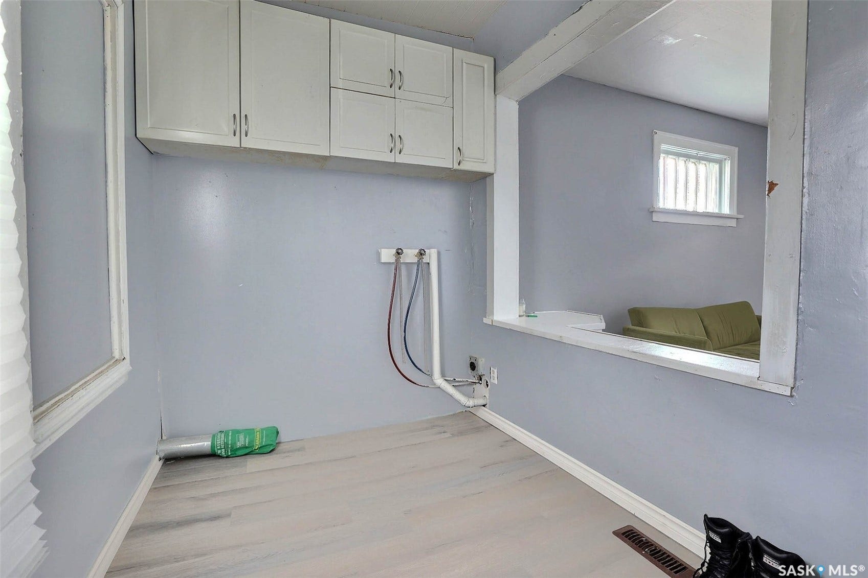 White overhead cabinetry with brushed nickel hardware