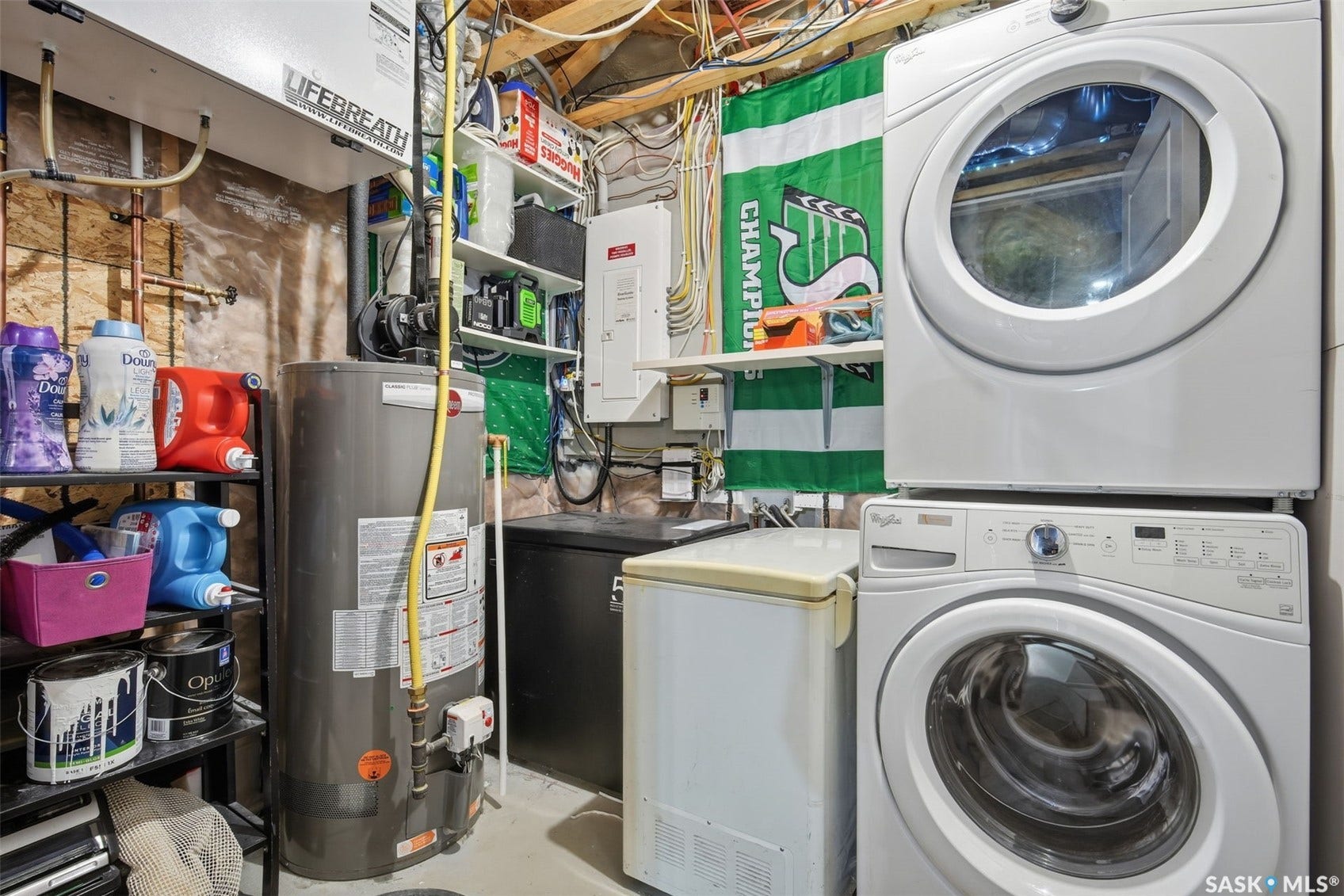 Stacked front-load washer and dryer, water heater, and utility shelving