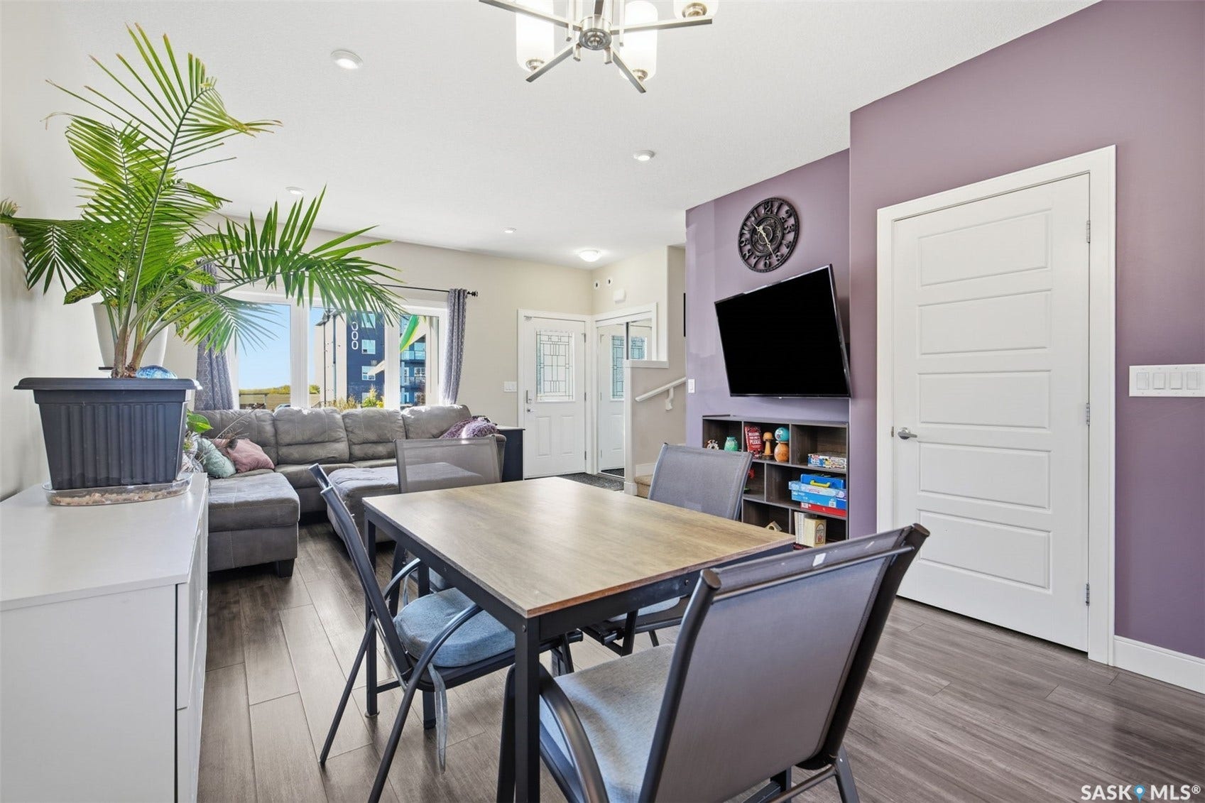 Wood-finish flooring throughout, recessed lighting, and a modern ceiling fixture