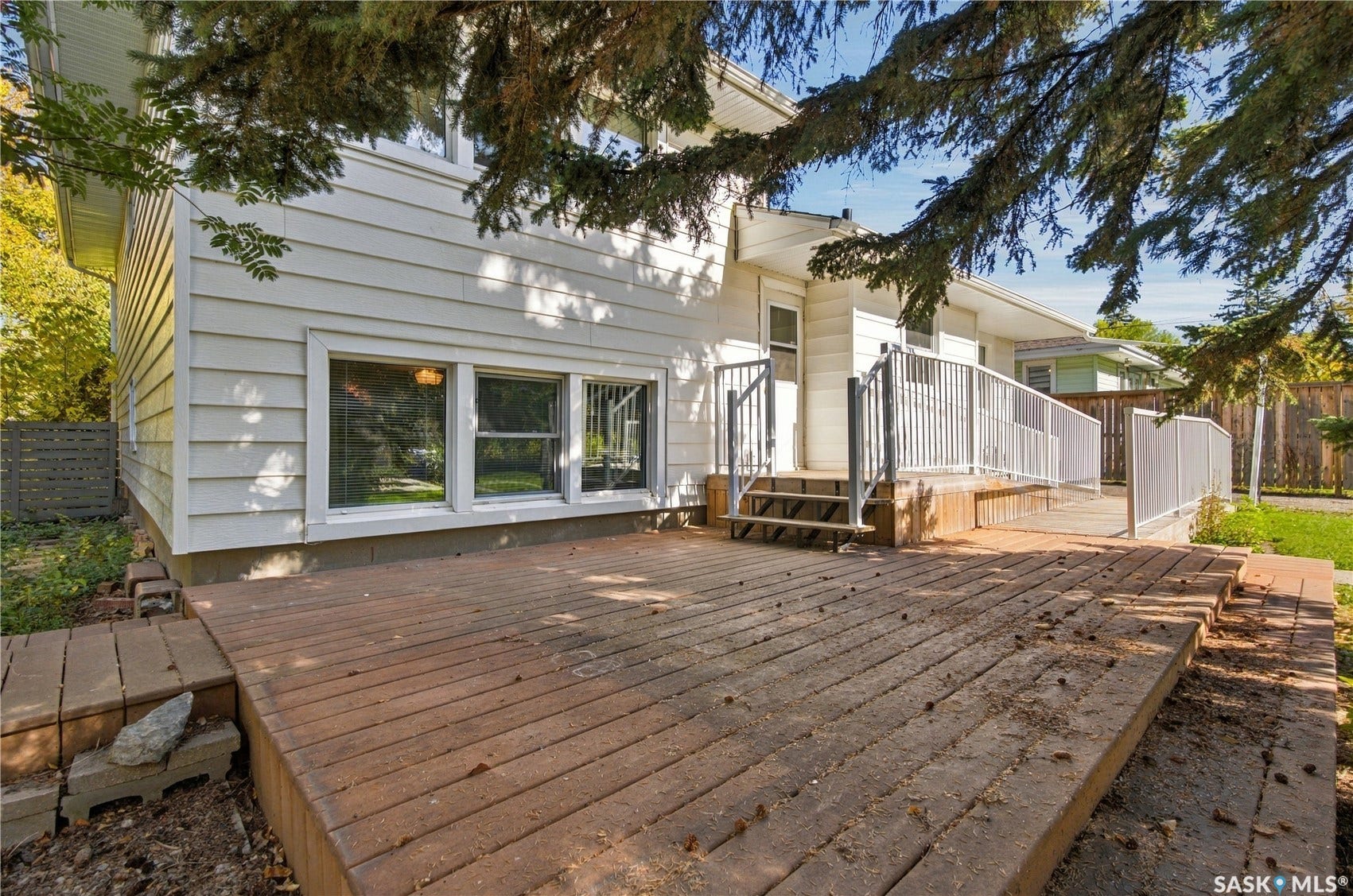 2727 Assiniboine Avenue, Regina SK S4S 1C7 Expansive wood deck with a ramp and railing system