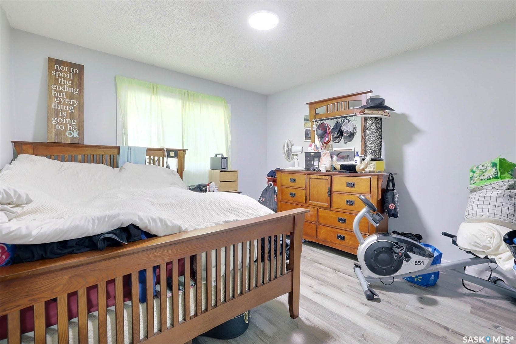 1021 Campbell Street, Regina SK S4T 5P5 Recessed ceiling light, light wood-finish flooring, and a large window