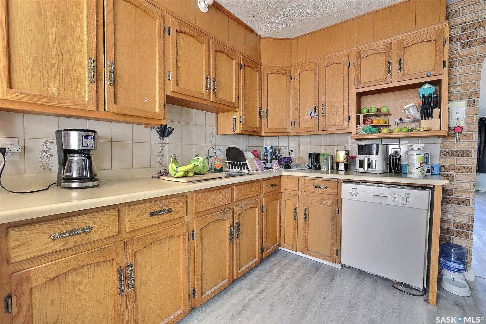1021 Campbell Street, Regina SK S4T 5P5 Light wood-finish cabinetry with decorative hardware