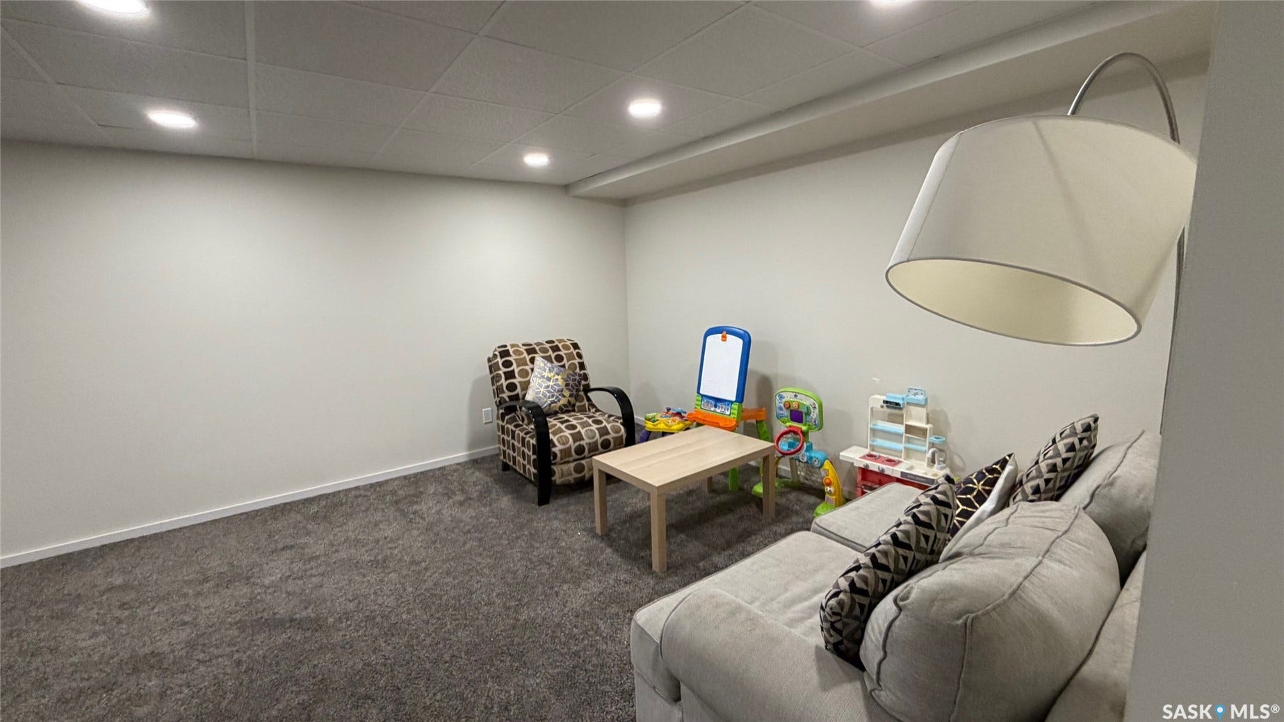 Recessed ceiling lighting, textured wall finishes, and wall-to-wall carpeting
