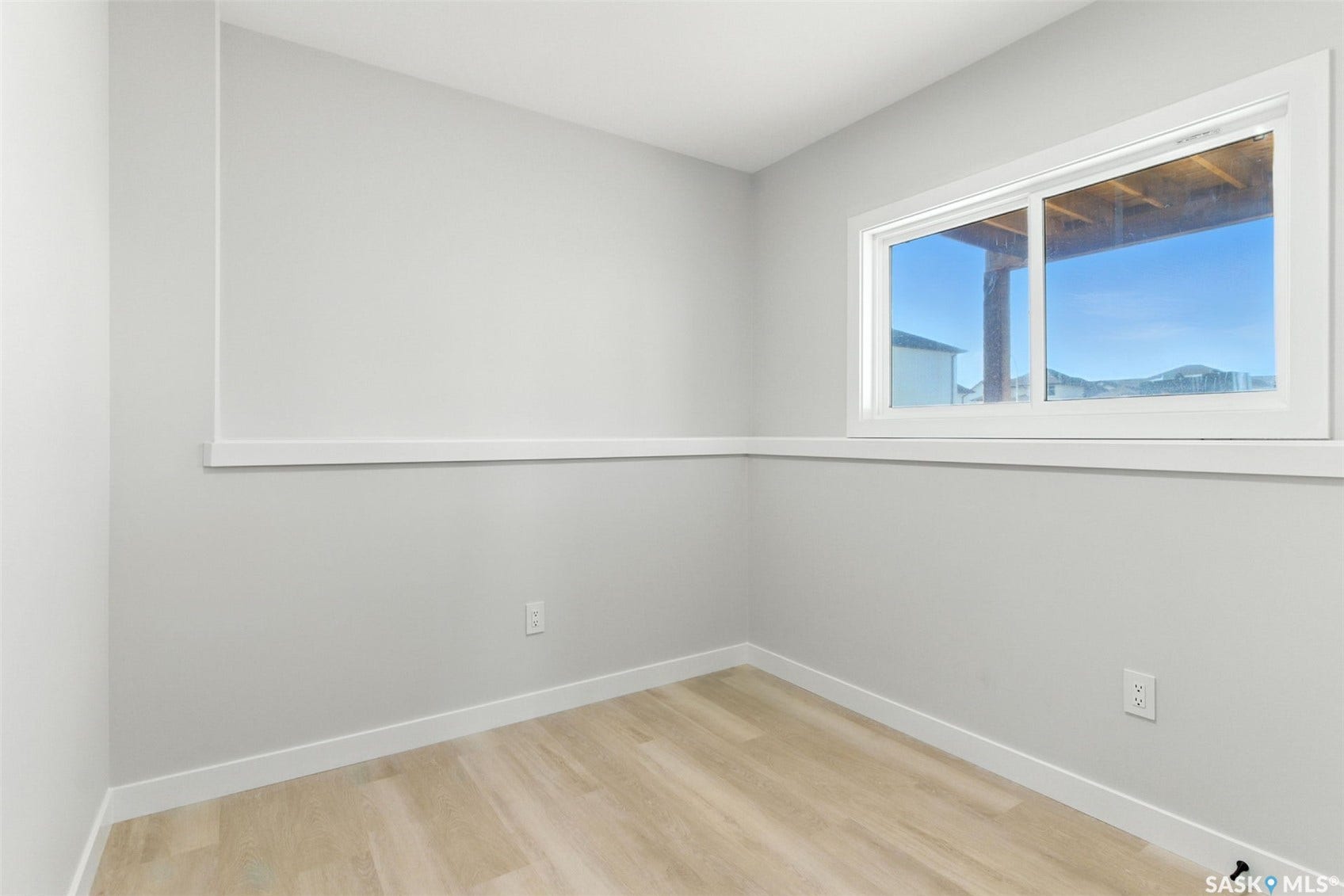 Light-toned walls with wood-finish flooring