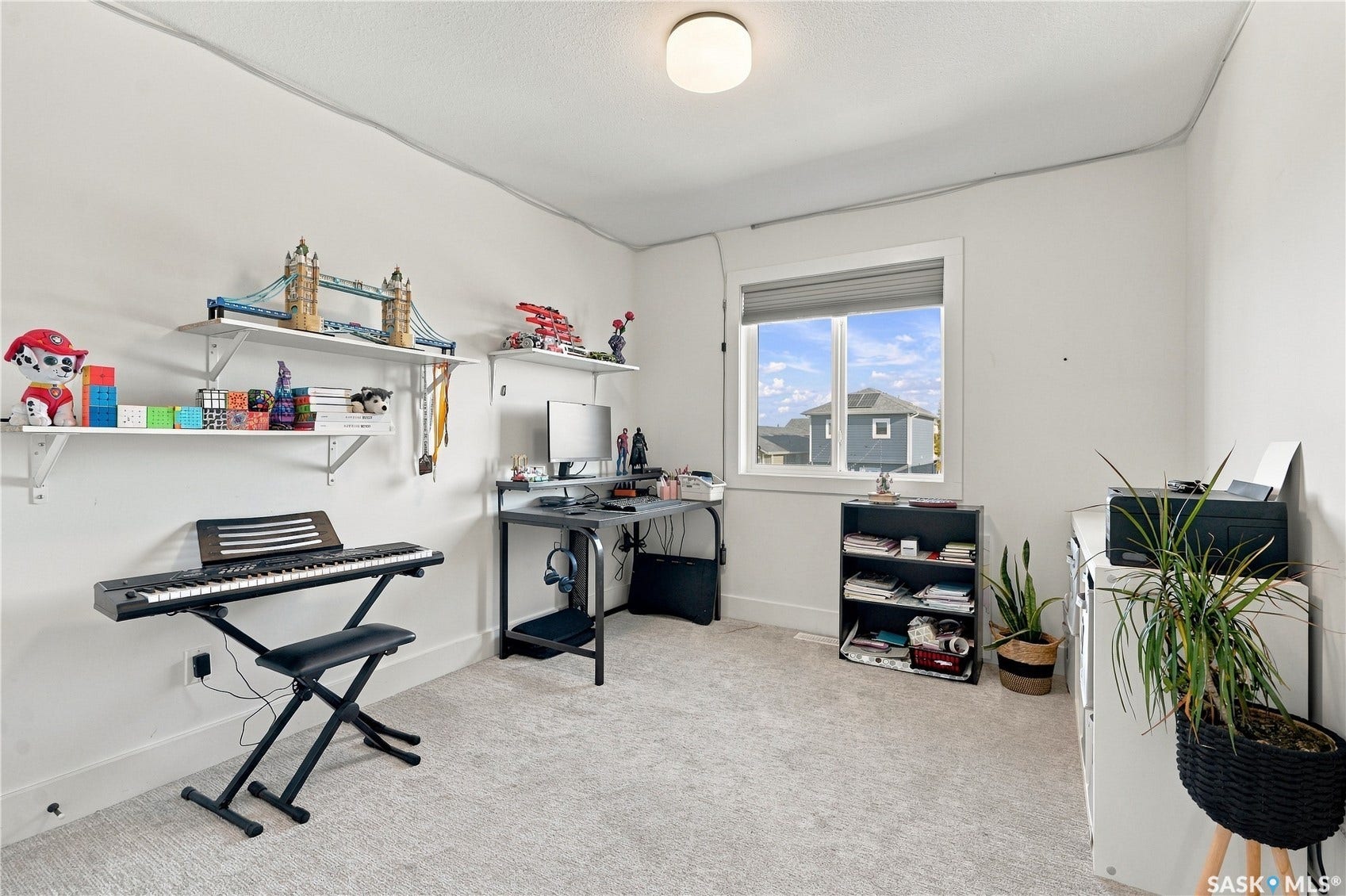 Recessed wall shelving, light neutral carpeting, and a window with blinds