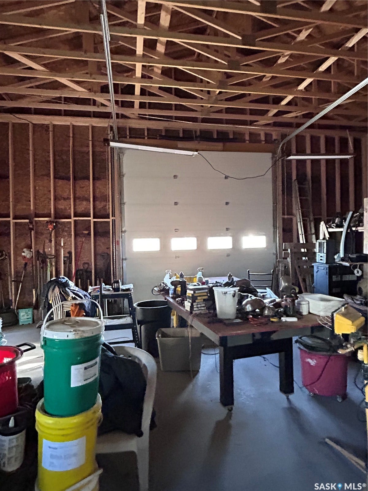 207 1st Street, North Portal SK S0C 1W0 Exposed ceiling trusses and wood-framed walls