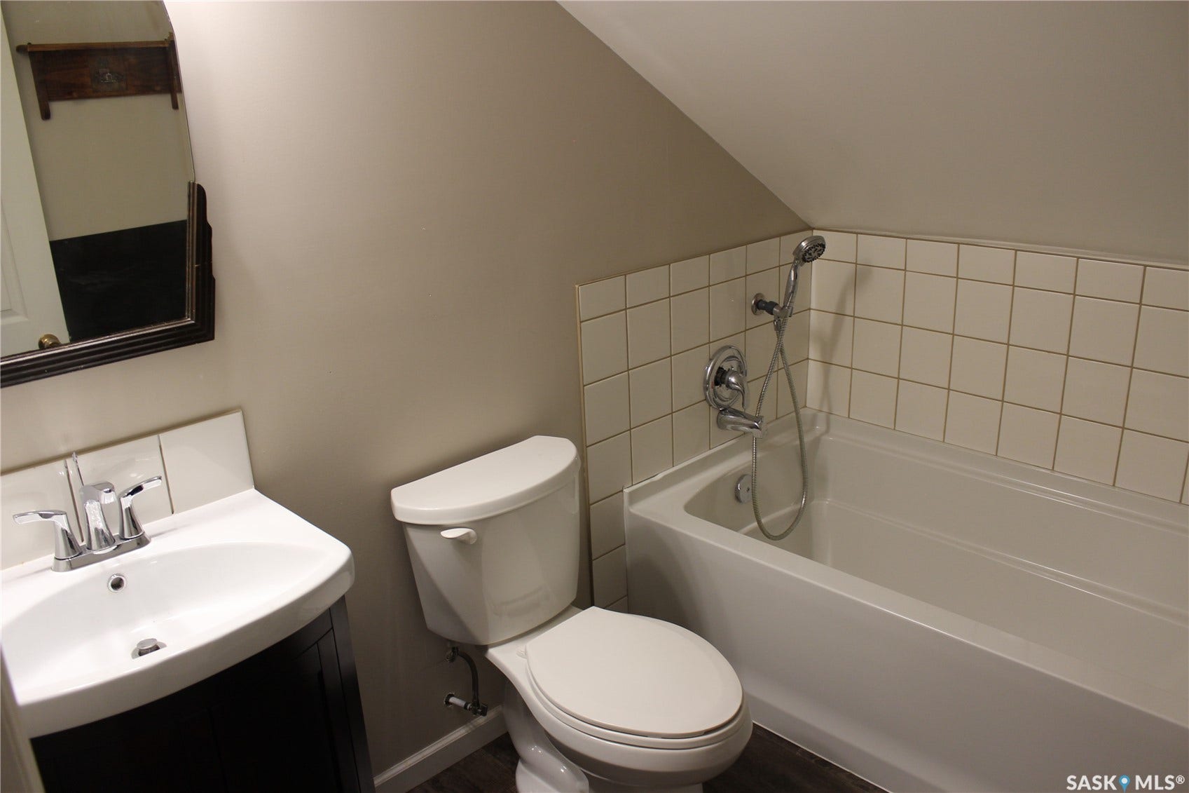 White ceramic tile shower surround