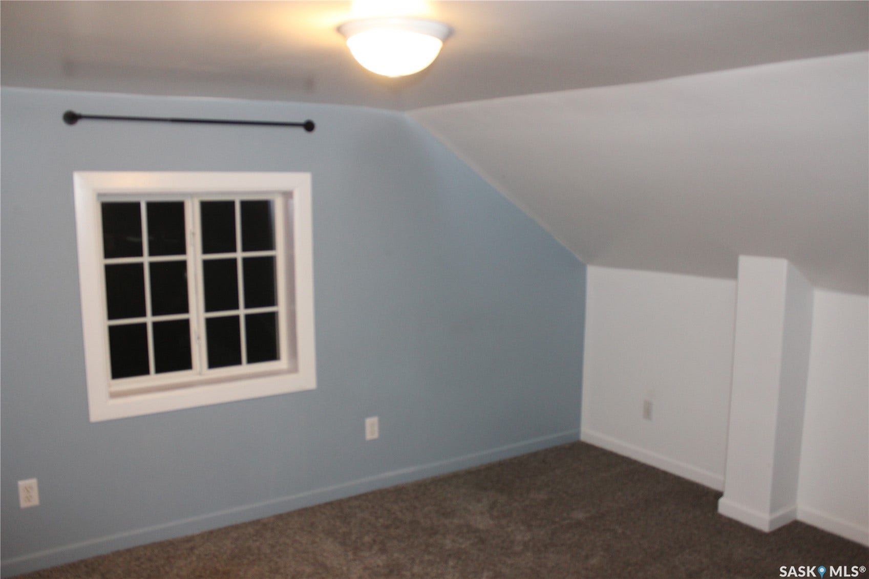 Recessed window with white trim, built-in ceiling lighting, and wall-to-wall carpeting