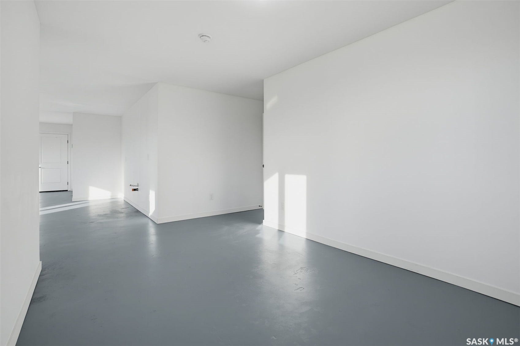White walls and gray flooring