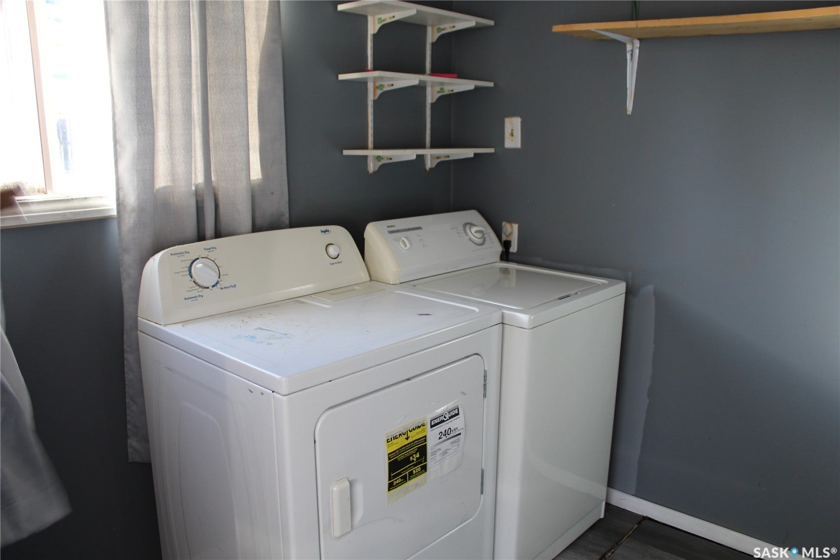 513 2nd Street W, Wilkie SK S0K 4W0 Laundry area with shelving