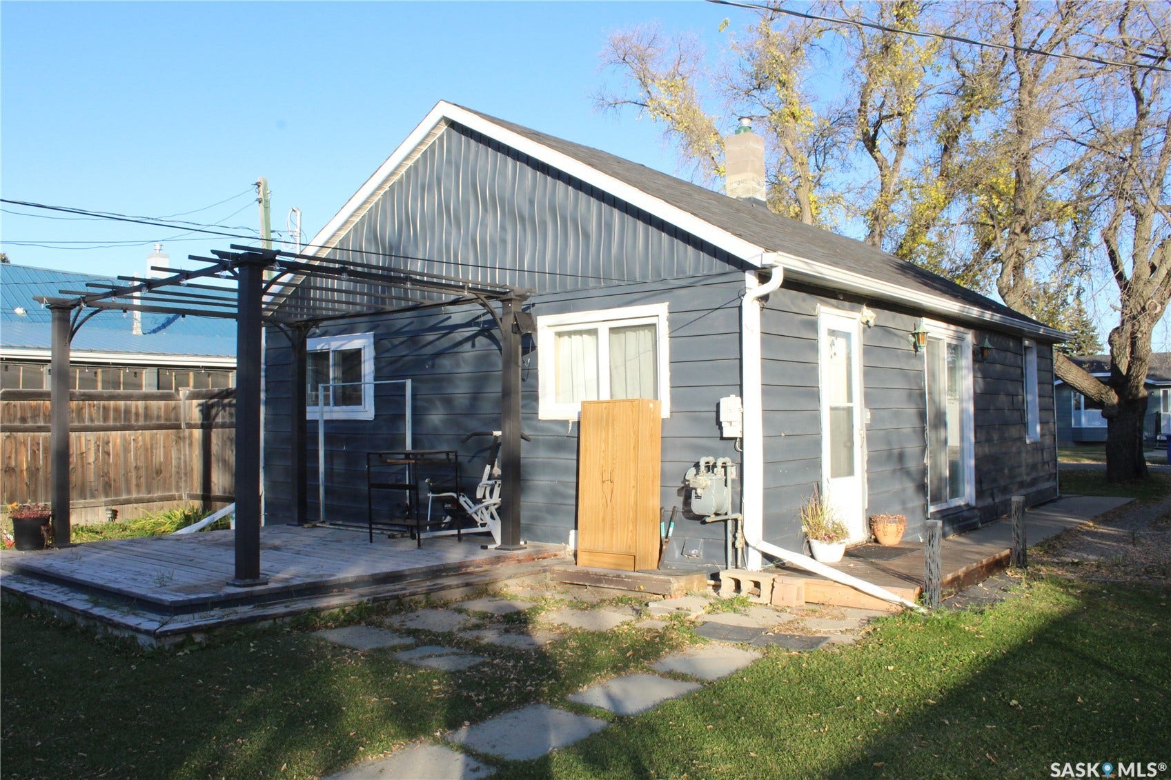 513 2nd Street W, Wilkie SK S0K 4W0 Rear exterior with horizontal siding and a gabled roof