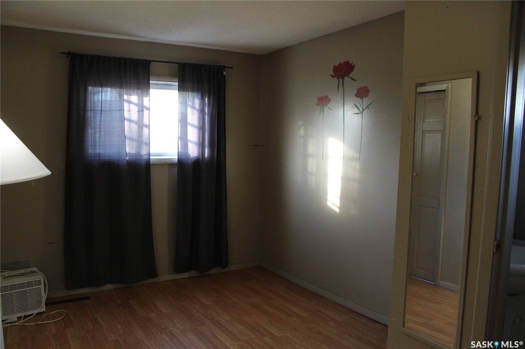 513 2nd Street W, Wilkie SK S0K 4W0 Wood-finish flooring with a single window