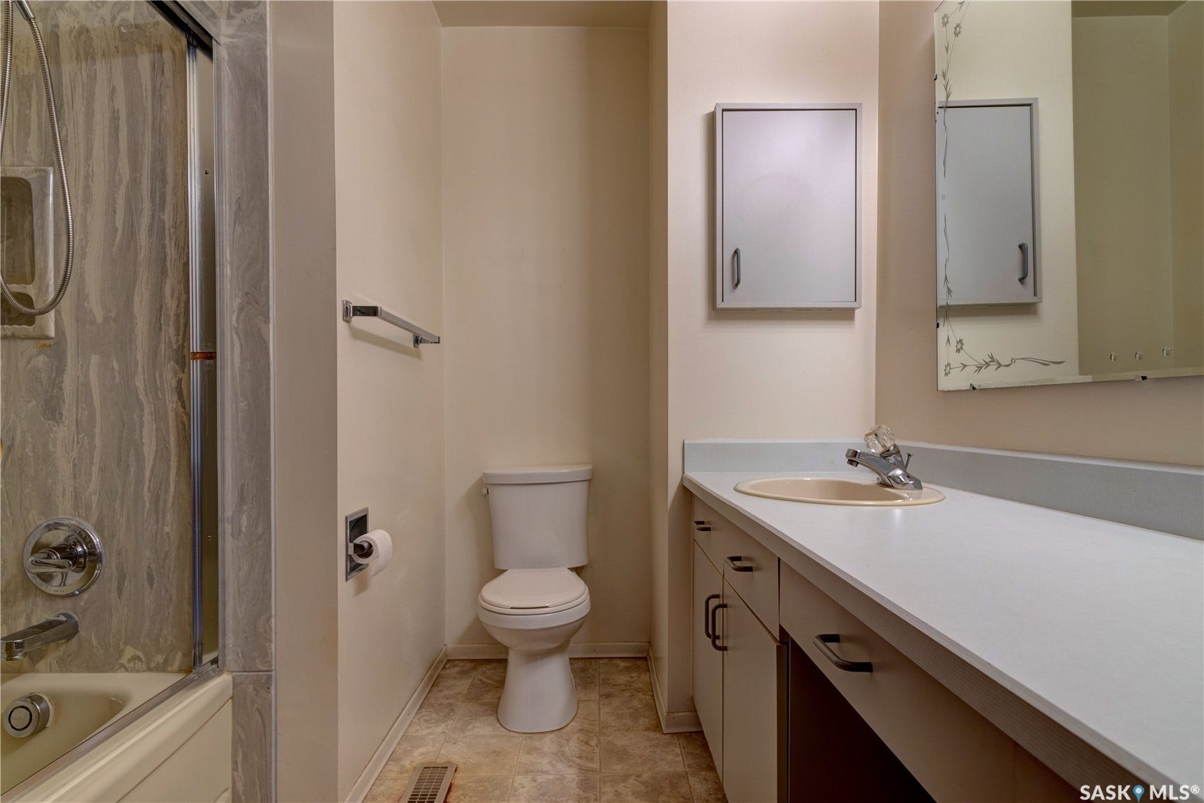Extended vanity with integrated sink, chrome faucet, and under-counter cabinetry
