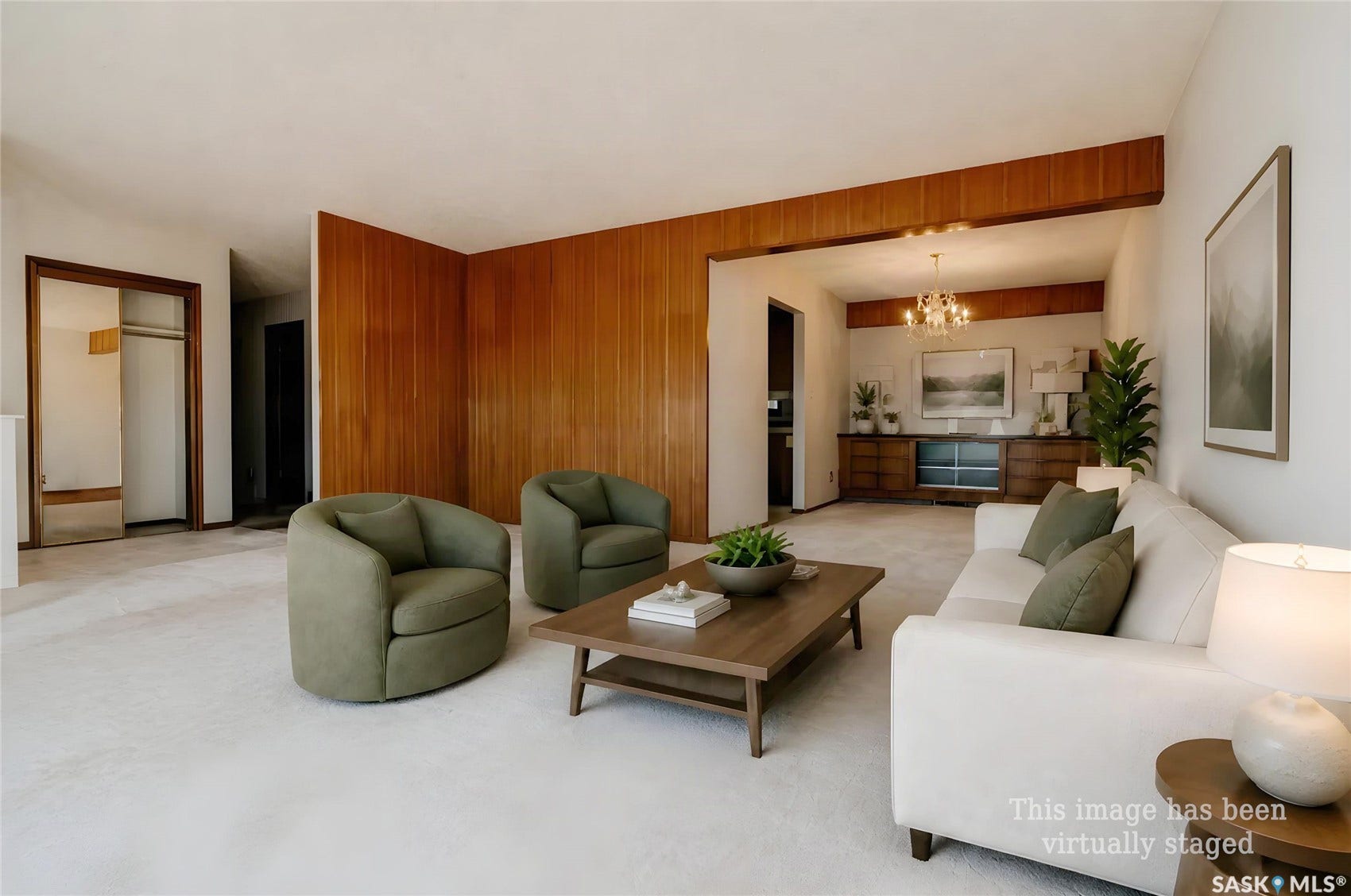Carpeted flooring throughout, wood paneling accents, and an open-concept layout