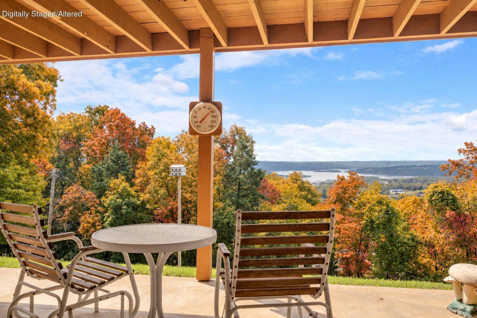 Lake house with natural Ozarks autumn fo