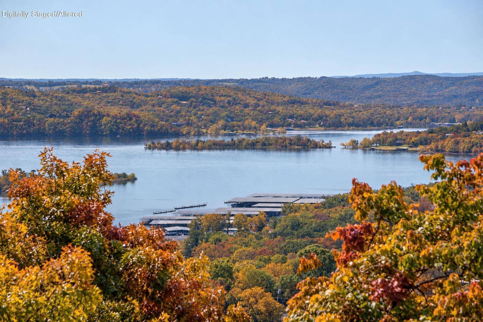 Ozarks home with natural autumn foliage-