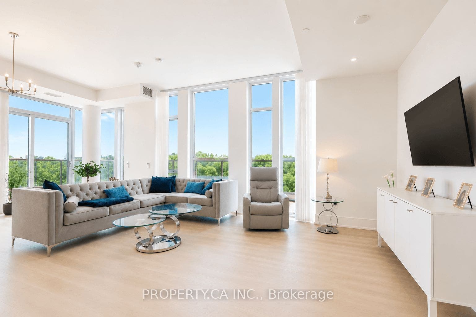 Living room with floor/ceiling windows facing golf