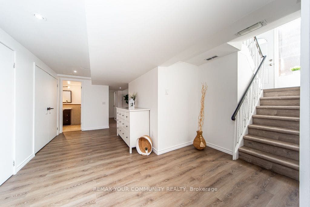 LOWER LEVEL-BRAND NEW VINYL FLOORING