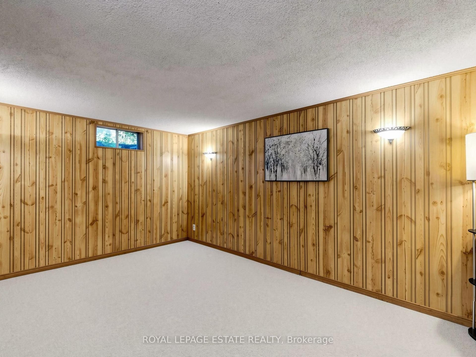 Wall sconces and window provide good lighting