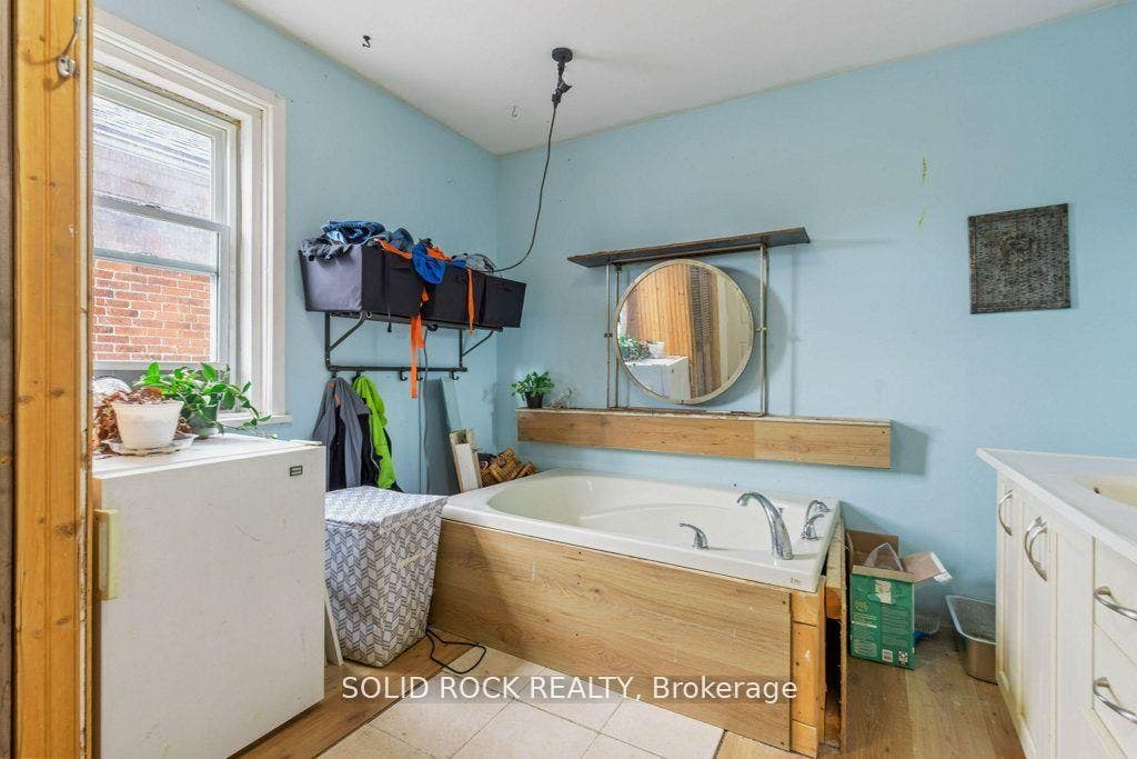 Bathroom features soaker tub, nice vanity