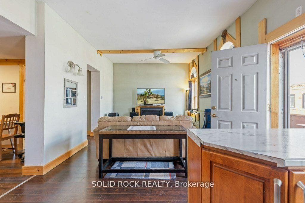 Living area with gas fireplace & tall ceilings!