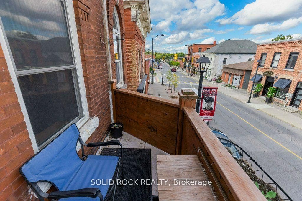 French dr leads to balcony overlooking Prescott St