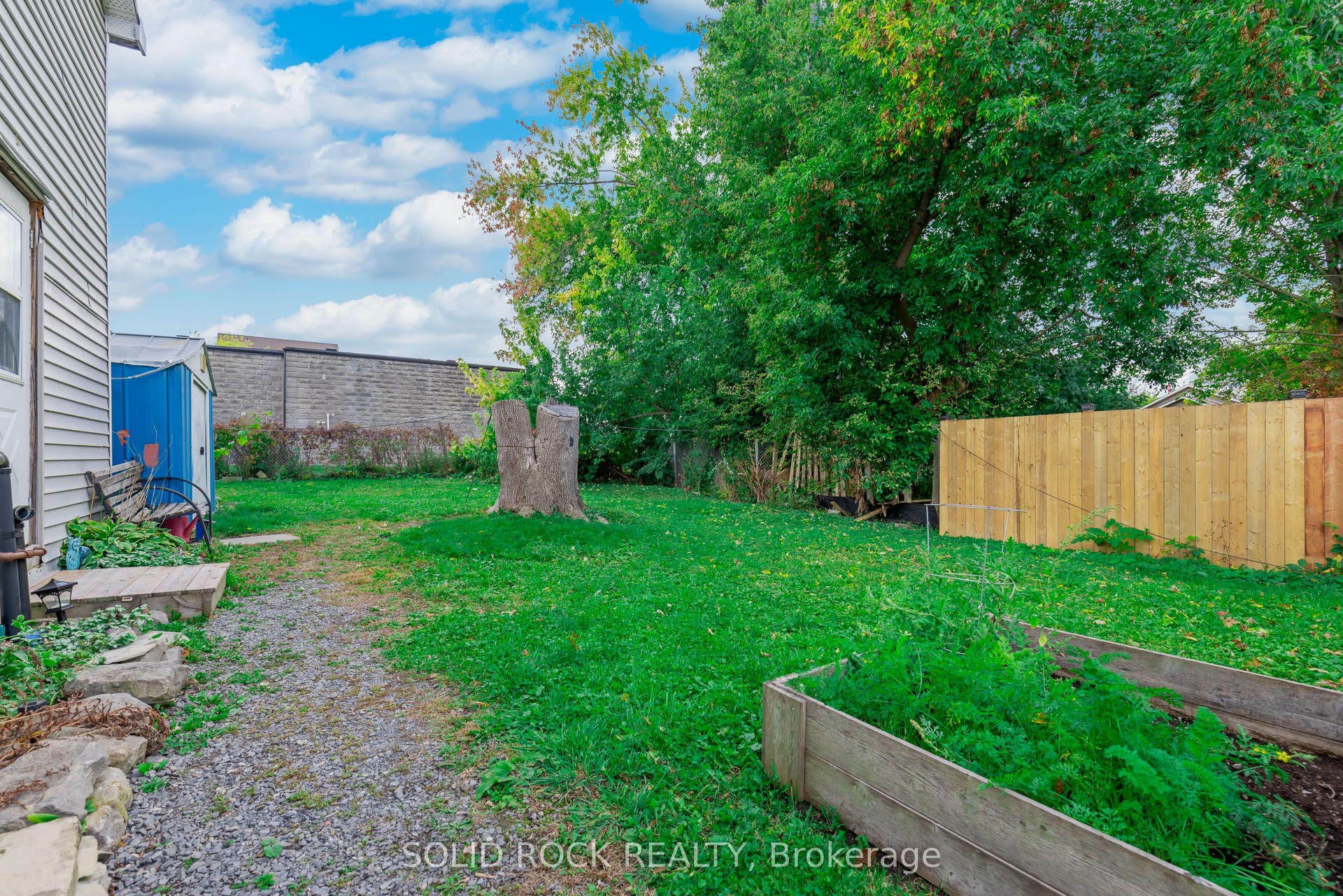 Rear yard behind bachelor & 1-bdrm apt